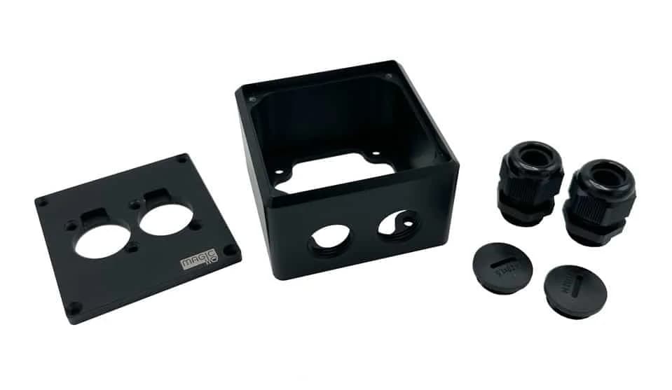 An exploded view of a Magic IO IO4: frontplate, aluminium body, cable glands and blindcaps